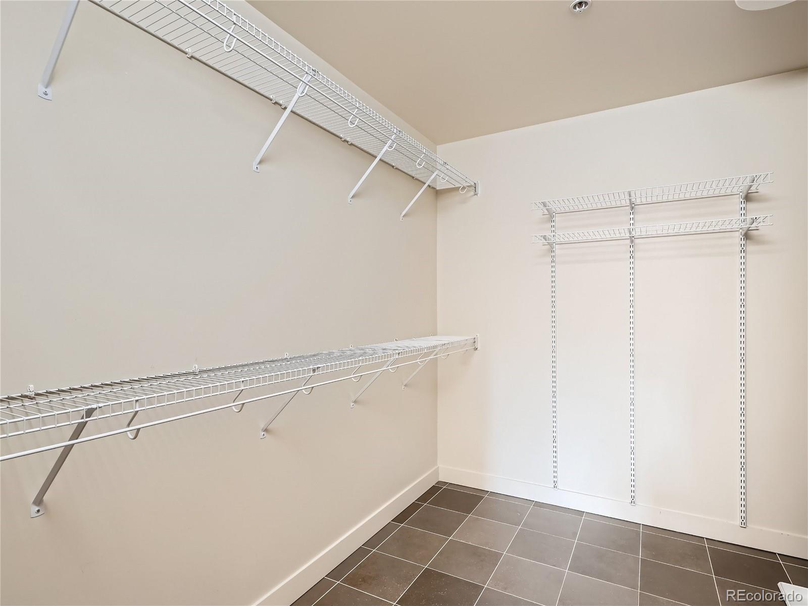 2229 Blake Street, Unit 406 Denver, CO 80205 - Photo 20 of 27 a view of an empty walk in closet