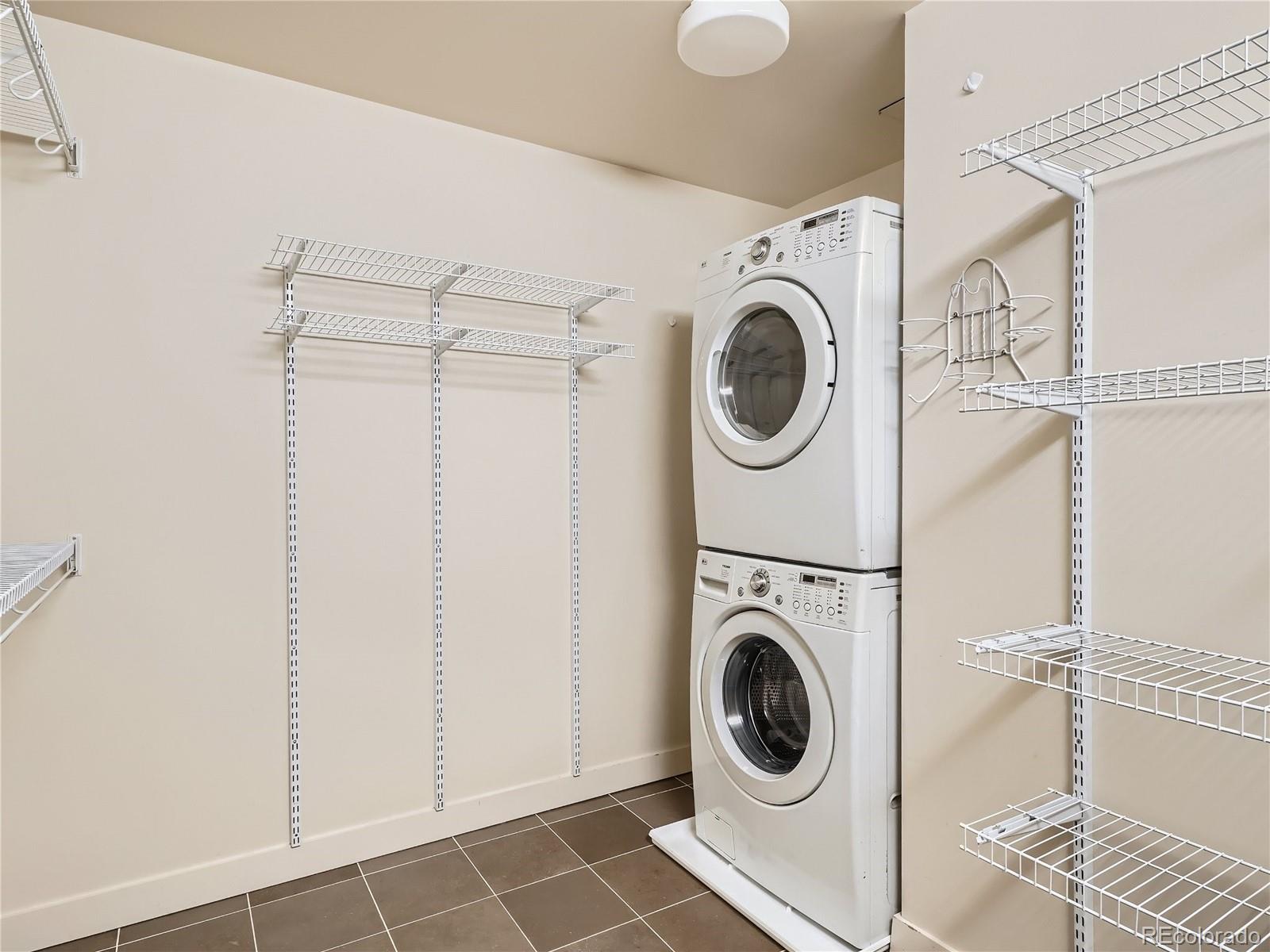 2229 Blake Street, Unit 406 Denver, CO 80205 - Photo 23 of 27 a utility room with dryer and washer