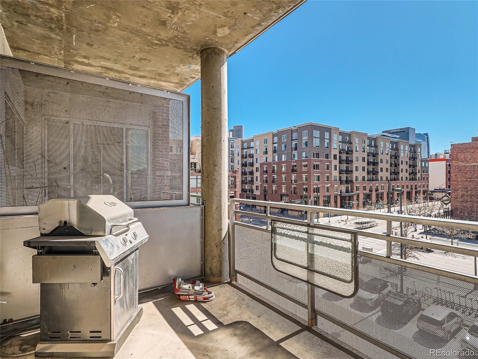 2229 Blake Street, Unit 406 Denver, CO 80205 - Photo 24 of 27 a view of a balcony with chairs