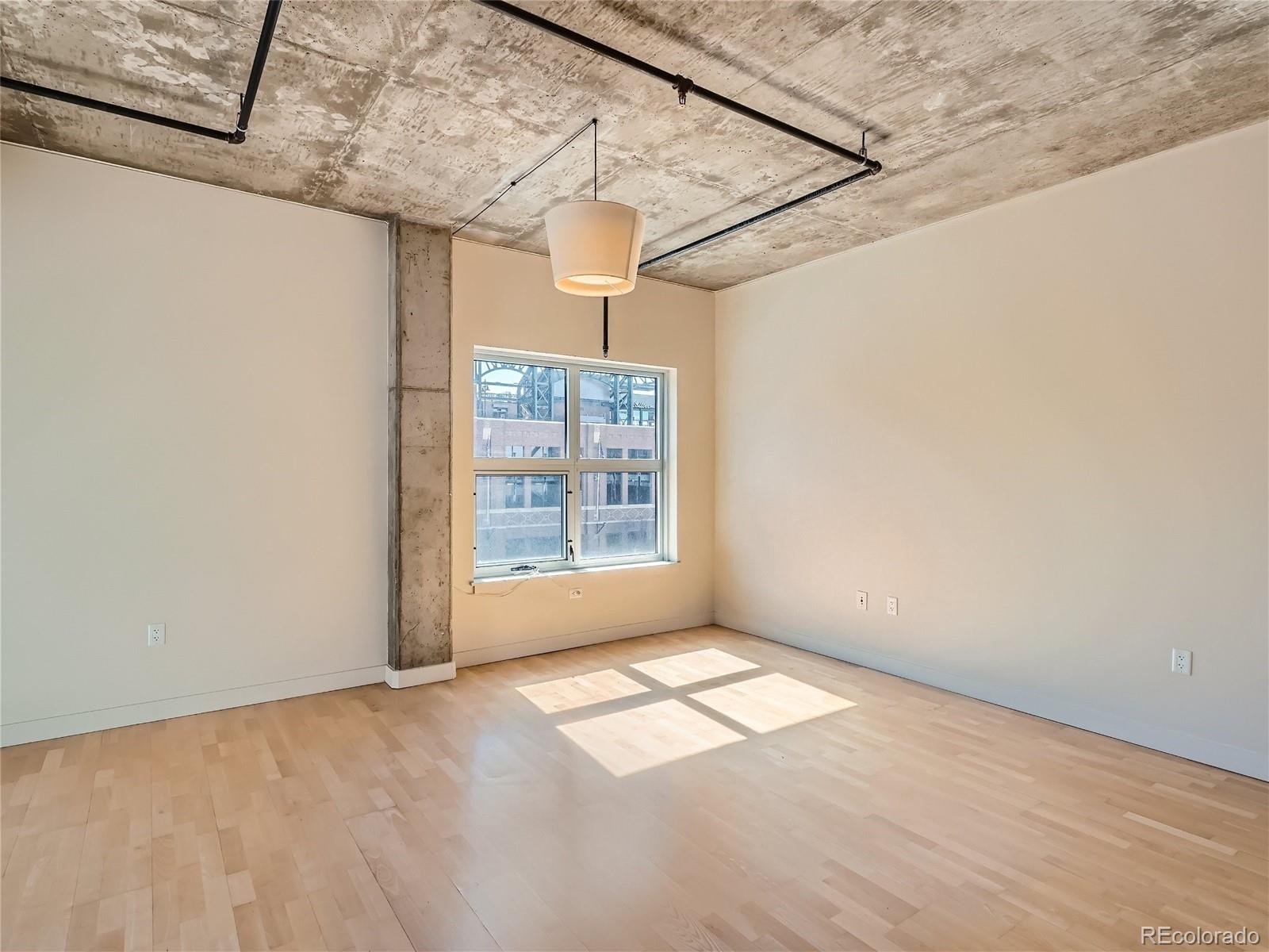 2229 Blake Street, Unit 406 Denver, CO 80205 - Photo 6 of 27 a view of empty room with window