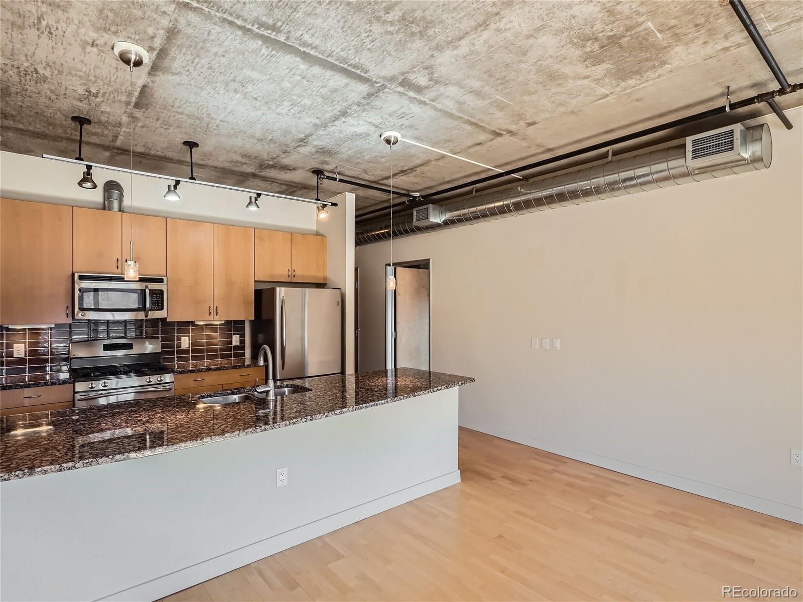2229 Blake Street, Unit 406 Denver, CO 80205 - Photo 9 of 27 a view of a room with wooden walls