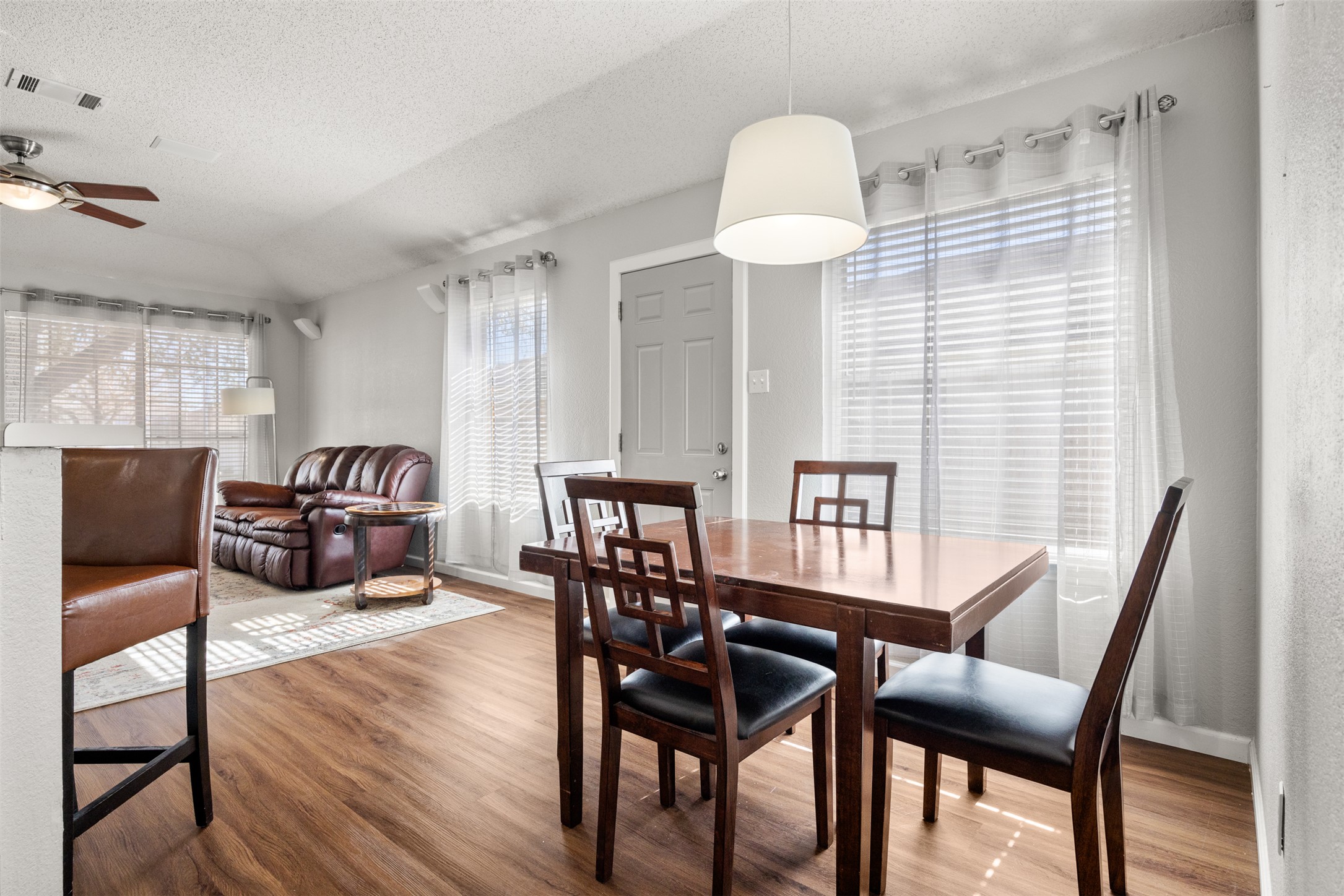 8120 Tockington Way Austin, TX 78748 - Photo 11 of 27 a view of a dining room with furniture window and wooden floor