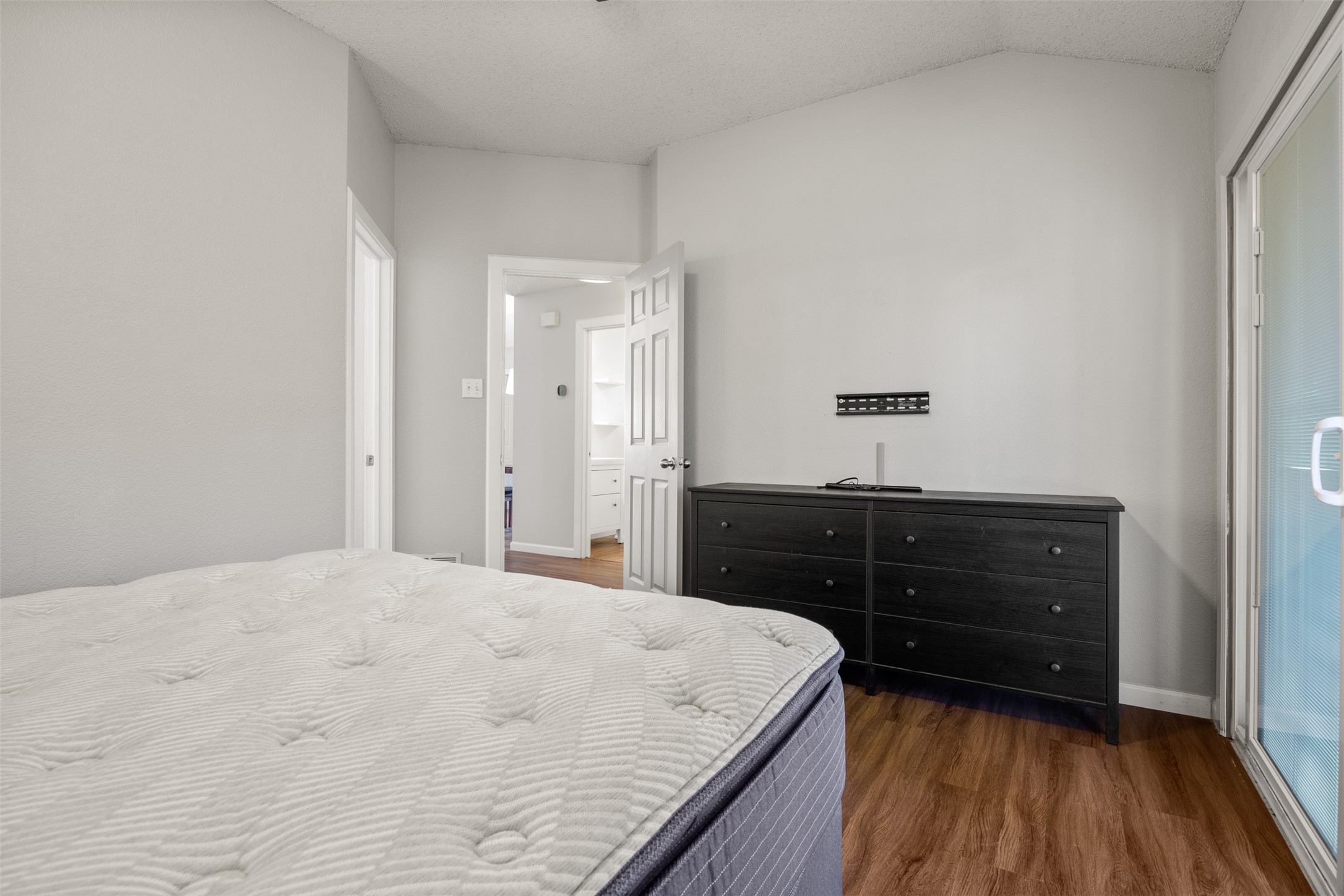 8120 Tockington Way Austin, TX 78748 - Photo 17 of 27 a bedroom with a bed and a dresser