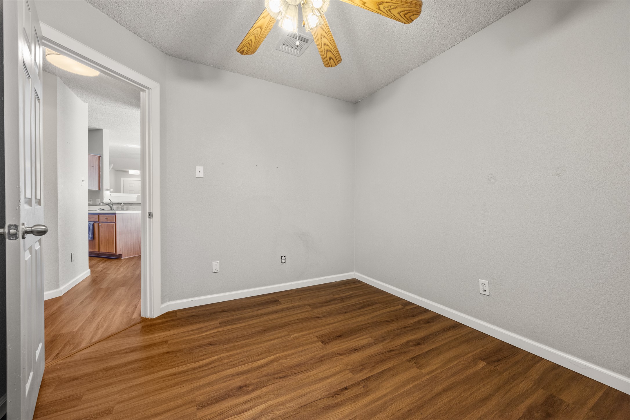 8120 Tockington Way Austin, TX 78748 - Photo 20 of 27 wooden floor in an empty room