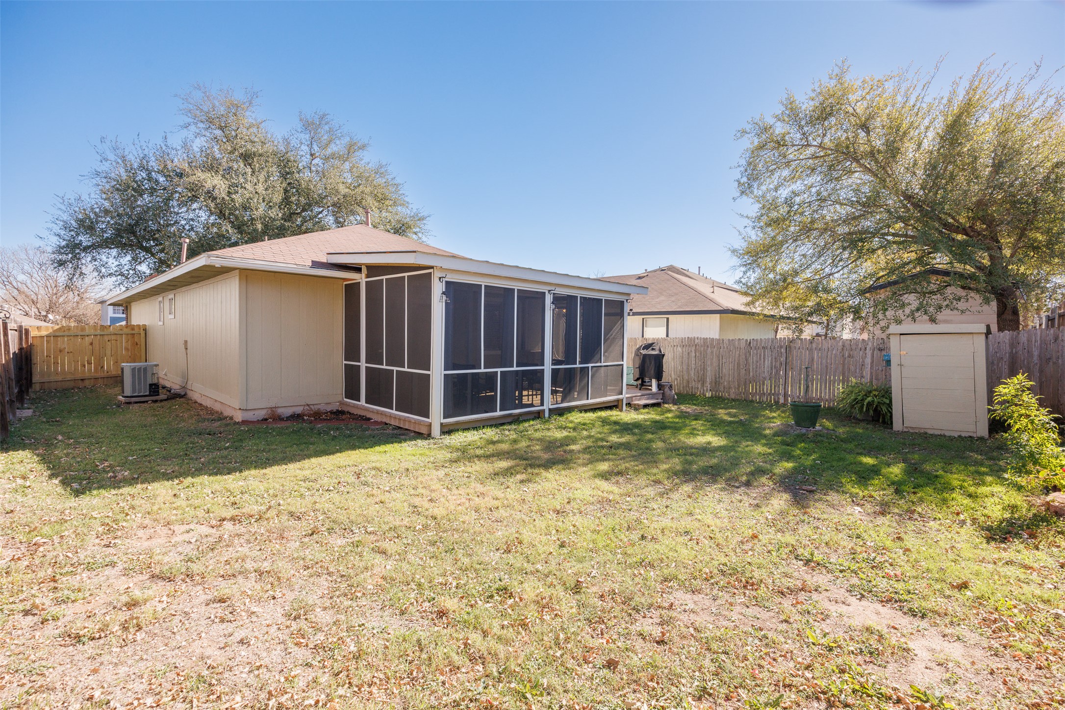 8120 Tockington Way Austin, TX 78748 - Photo 26 of 27 a view of a backyard with a small cabin