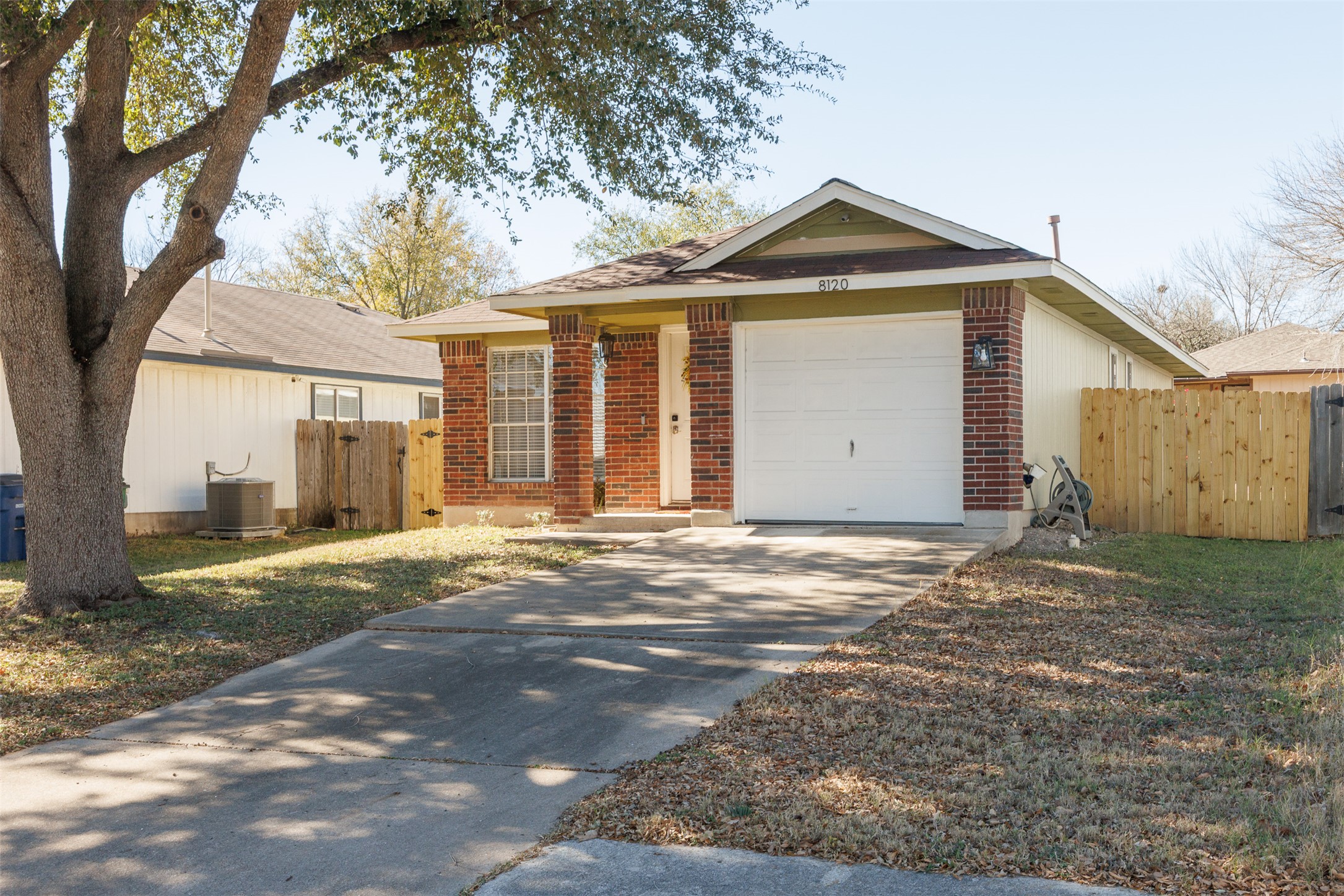 8120 Tockington Way Austin, TX 78748 - Photo 4 of 27 a front view of a house with a yard and garage