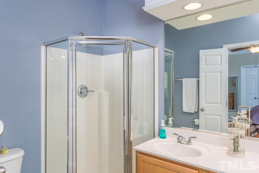 5206 Groveside Court Raleigh, NC 27613 - Photo 6 of 12 a bathroom with a sink and a mirror