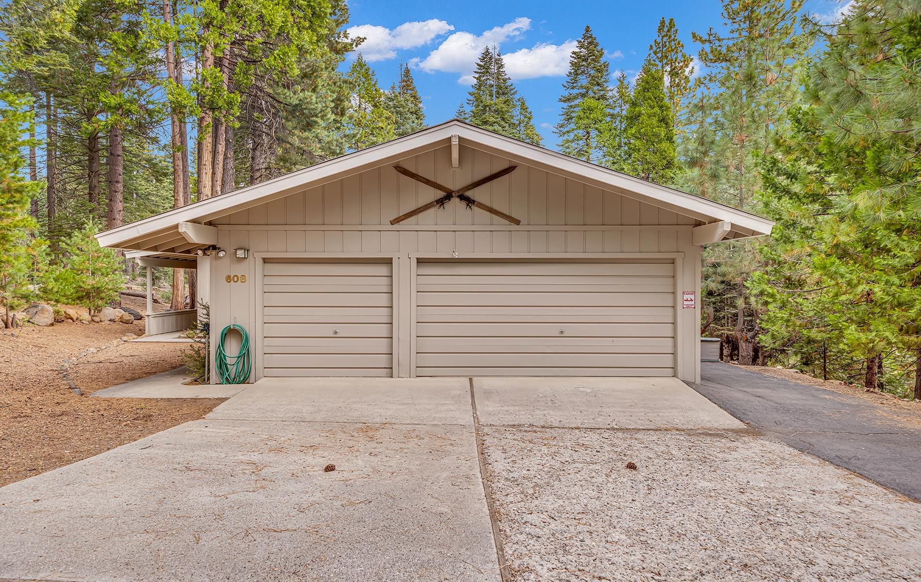 608 East Burnt Cedar Road Lake Almanor, CA 96137 - Photo 32 of 36 a view of a house with a yard and garage