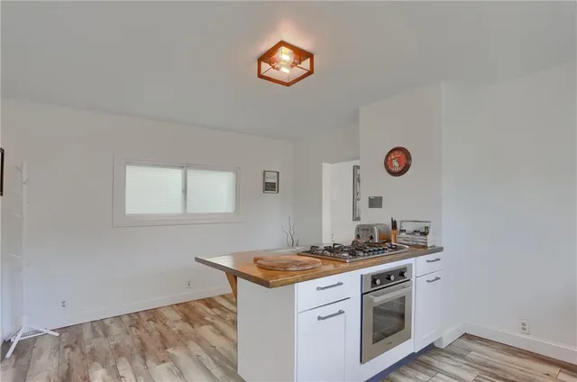 a kitchen with a stove and a microwave