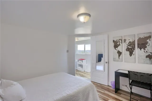 a bedroom with a bed and a couch