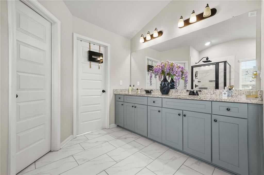 118 Arabella Pike Locust Grove, GA 30248 - Photo 26 of 39 a spacious bathroom with a double vanity sink mirror and