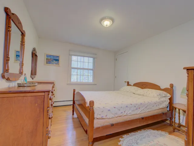 a bedroom with a bed and a table in it