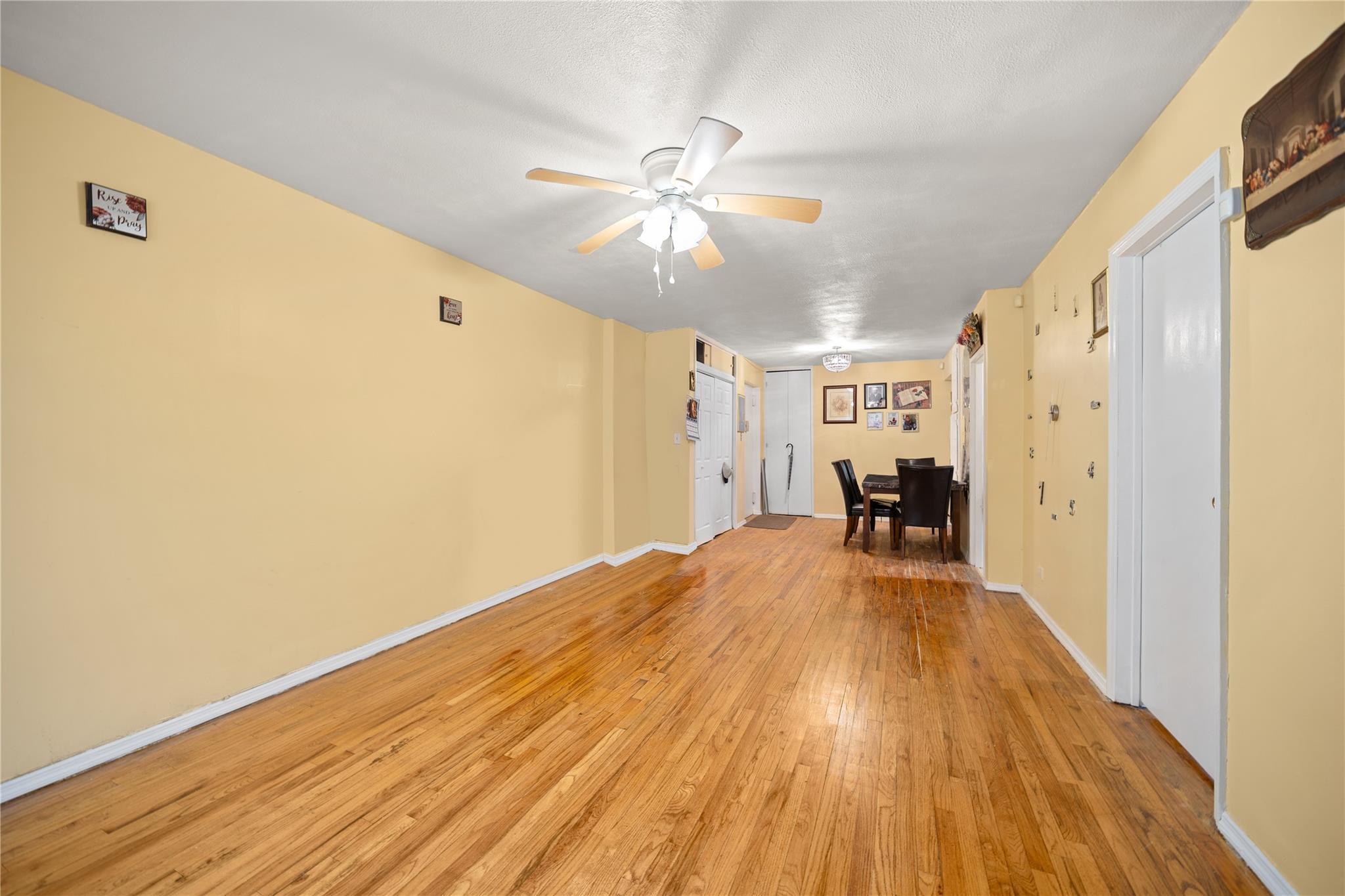 1199 East 53rd Street, Unit 1D Brooklyn, NY 11234 - Photo 6 of 10 a view of a livingroom with a chandelier