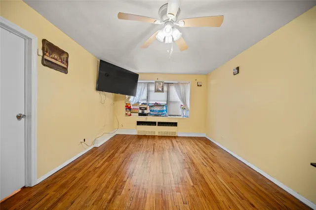 a view of a livingroom with wooden floor