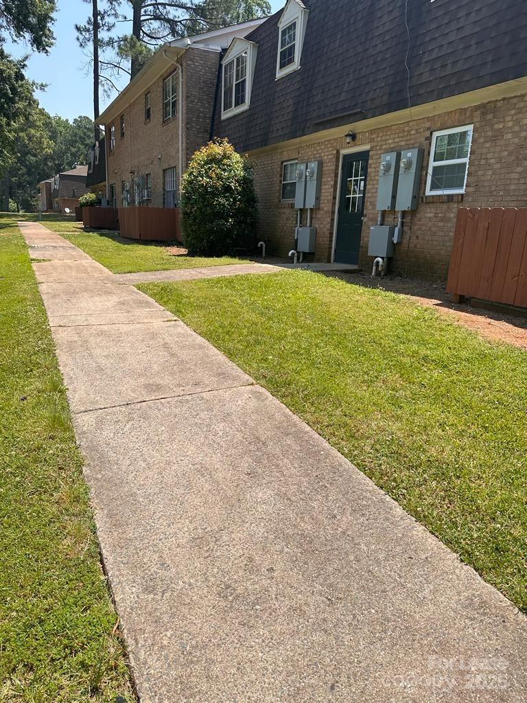 5808 Hunting Ridge Lane, Unit A Charlotte, NC 28212 - Photo 6 of 18 a view of a house with a yard