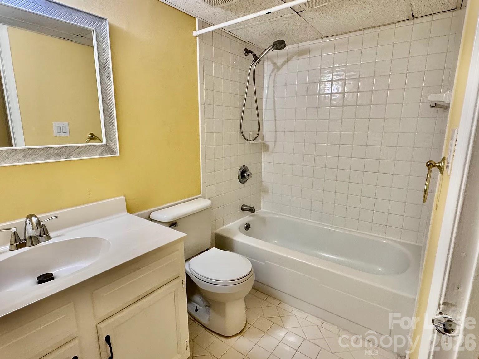 5808 Hunting Ridge Lane, Unit A Charlotte, NC 28212 - Photo 7 of 7 a bathroom with a toilet sink and shower