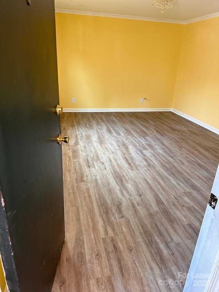 5808 Hunting Ridge Lane, Unit A Charlotte, NC 28212 - Photo 8 of 18 a view of a room with wooden floor