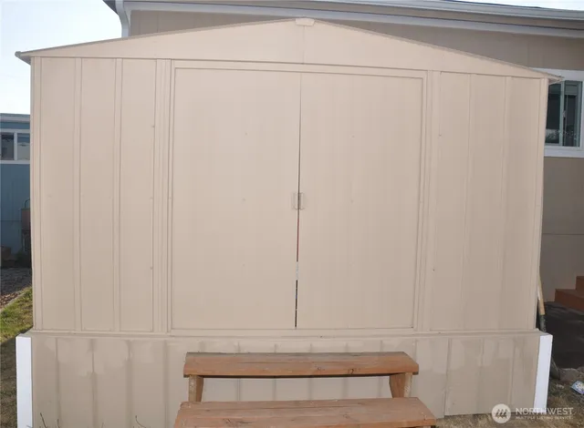 a view of a garden with a building in the background