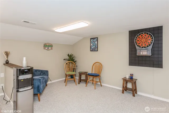 a reading room with furniture and a window