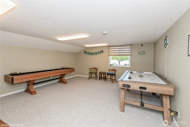 a view of a patio with a table and chairs and potted plants