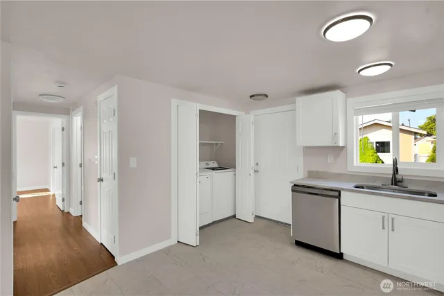 a kitchen with cabinets and sink