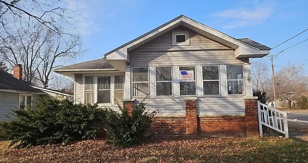 a front view of a house with garage