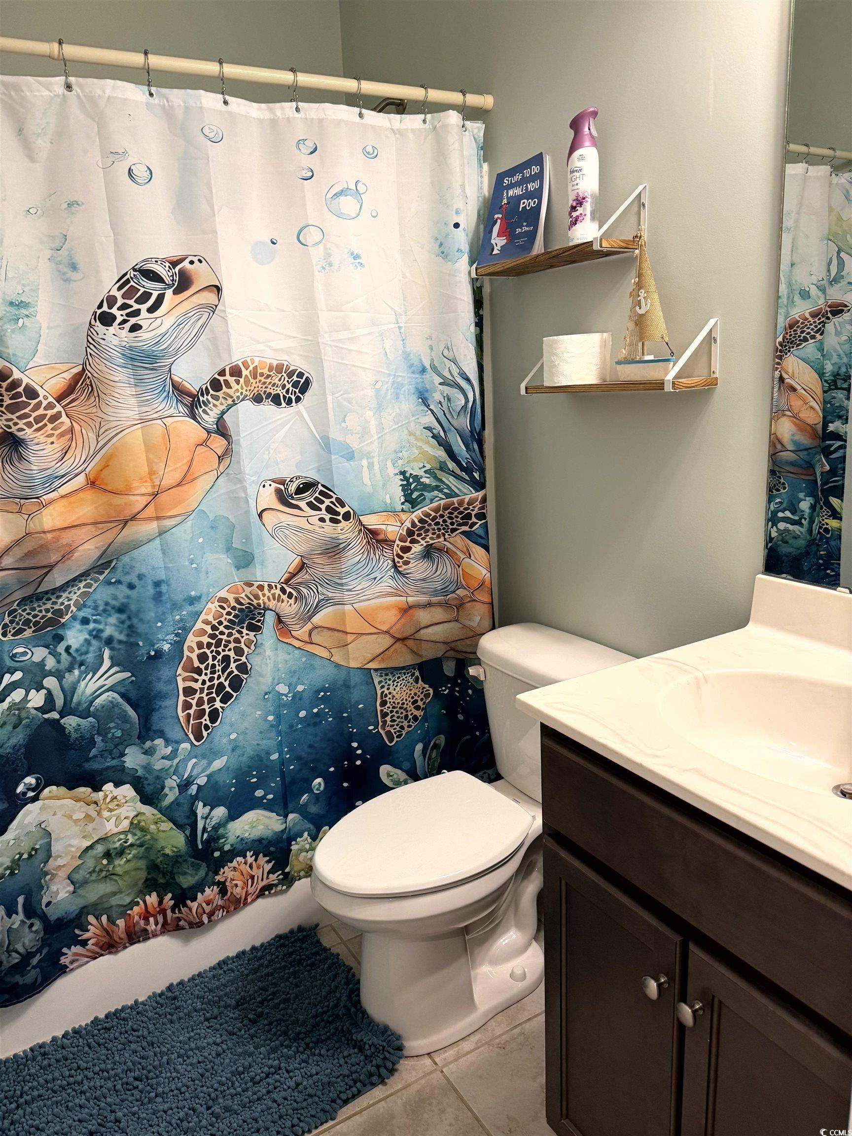257 Maiden's Choice Drive Conway, SC 29527 - Photo 16 of 29 Full bathroom featuring a shower with curtain, vanity, and light tile patterned floors