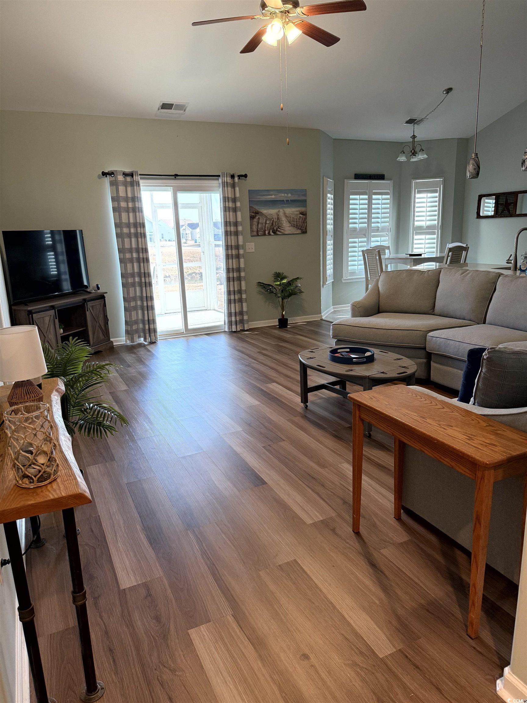257 Maiden's Choice Drive Conway, SC 29527 - Photo 5 of 29 Living room with wood finished floors, ceiling fan, and plenty of natural light