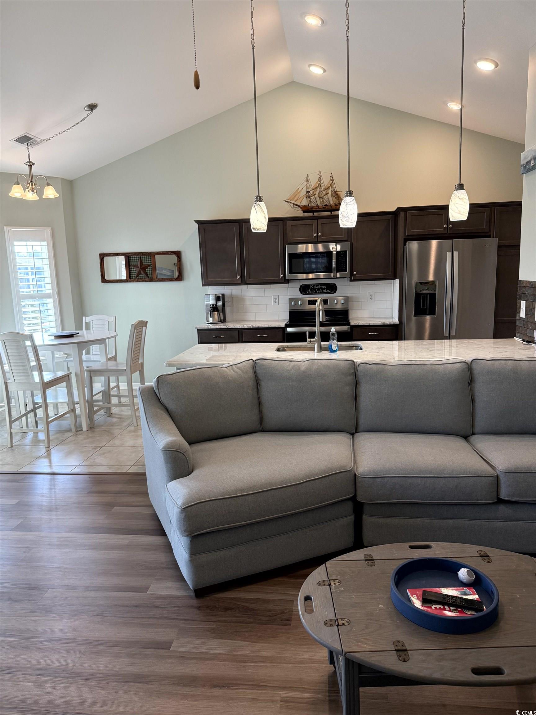 257 Maiden's Choice Drive Conway, SC 29527 - Photo 8 of 29 Living area featuring vaulted ceiling and light wood-style flooring