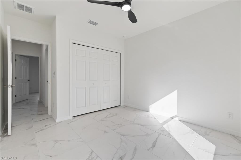 3707 Sunset Road Lehigh Acres, FL 33971 - Photo 11 of 16 a view of an empty room