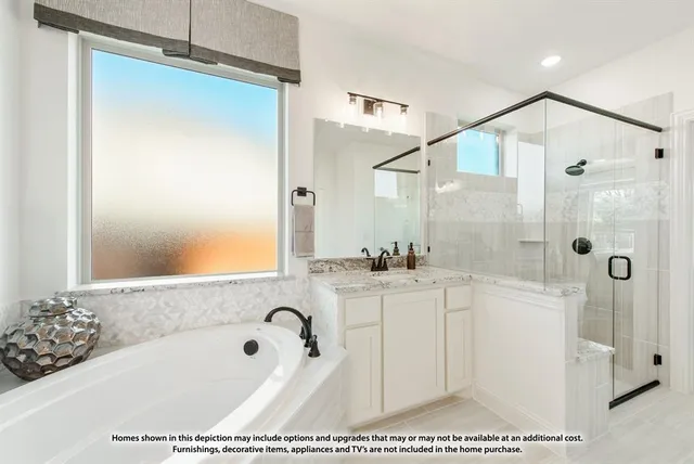 a bathroom with a tub a sink and mirror