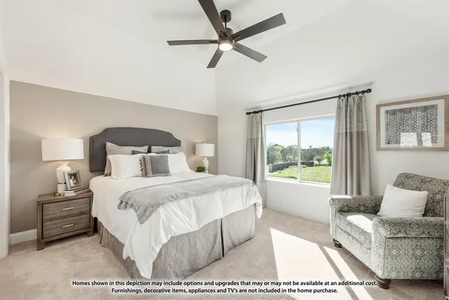 a bedroom with a bed a couch and a window