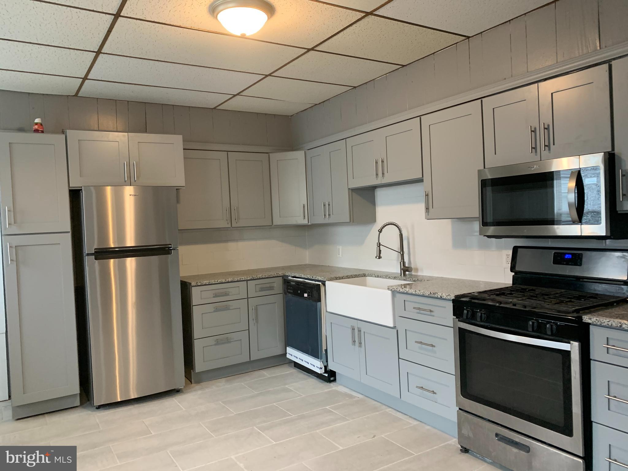 822 Columbus Road Burlington, NJ 08016 - Photo 17 of 32 a kitchen with stainless steel appliances a refrigerator sink and white cabinets