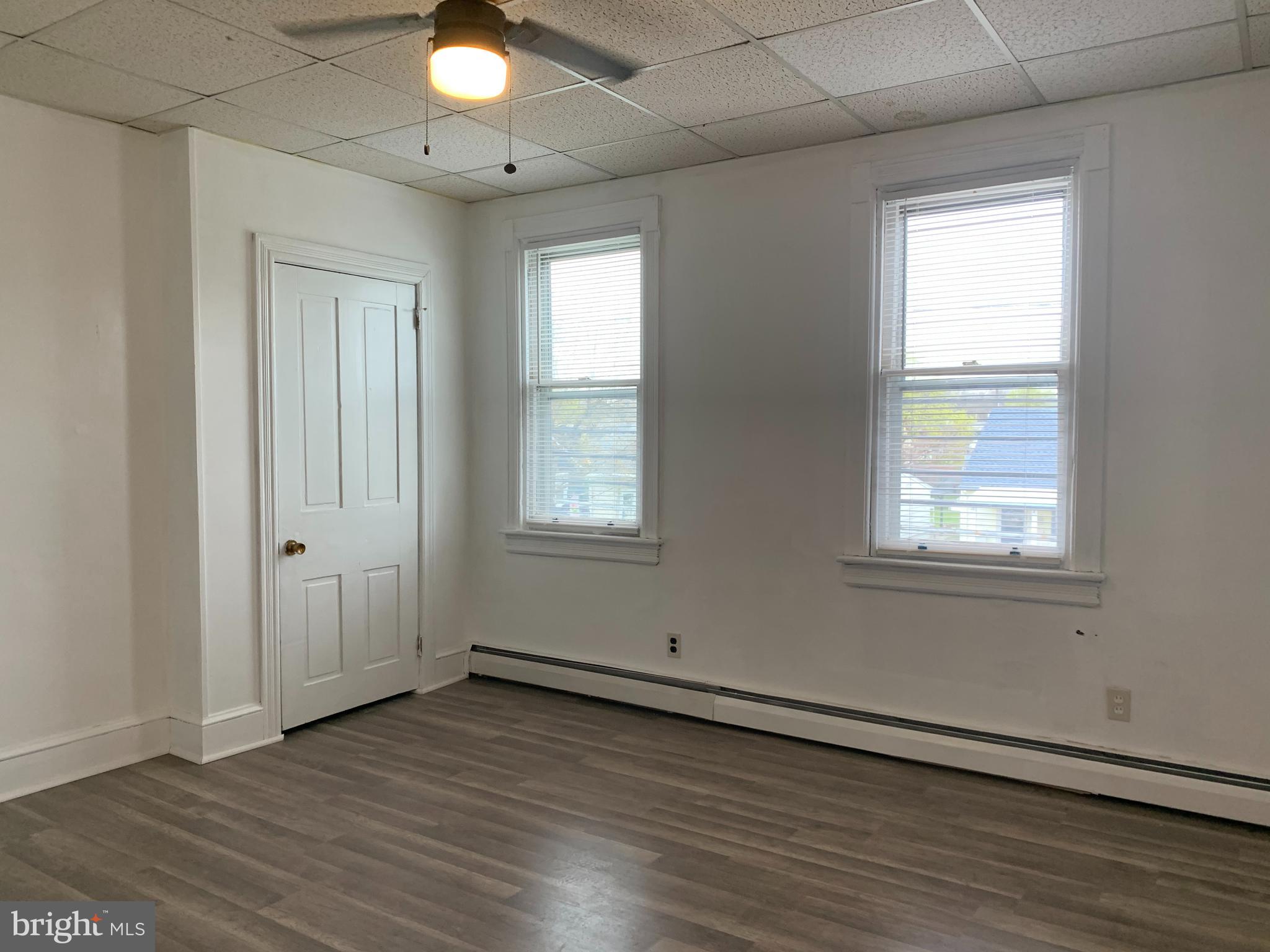 822 Columbus Road Burlington, NJ 08016 - Photo 22 of 32 an empty room with wooden floor and windows
