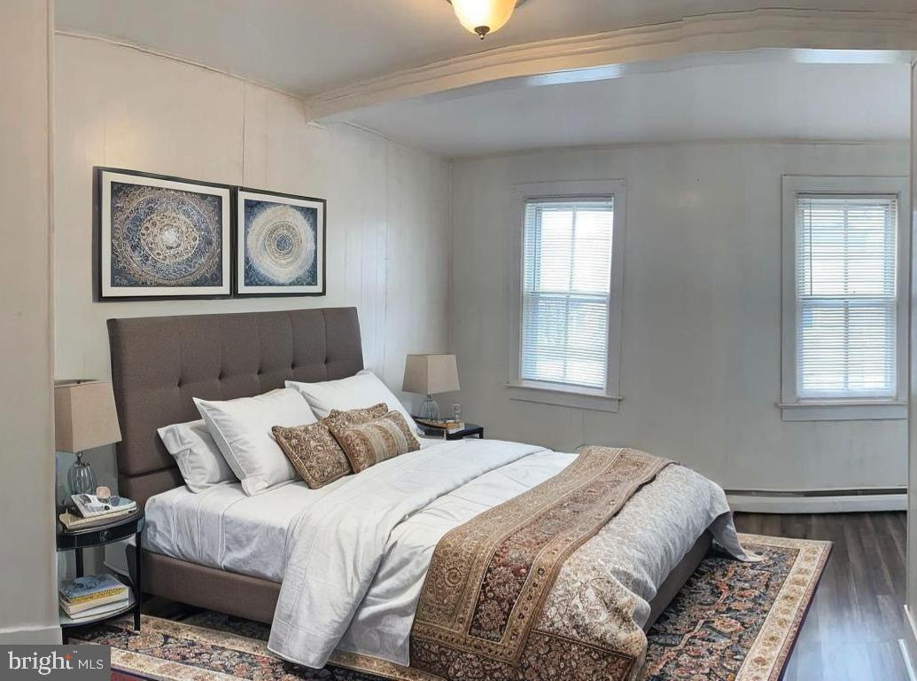 822 Columbus Road Burlington, NJ 08016 - Photo 25 of 32 a bedroom with a bed and wooden floor