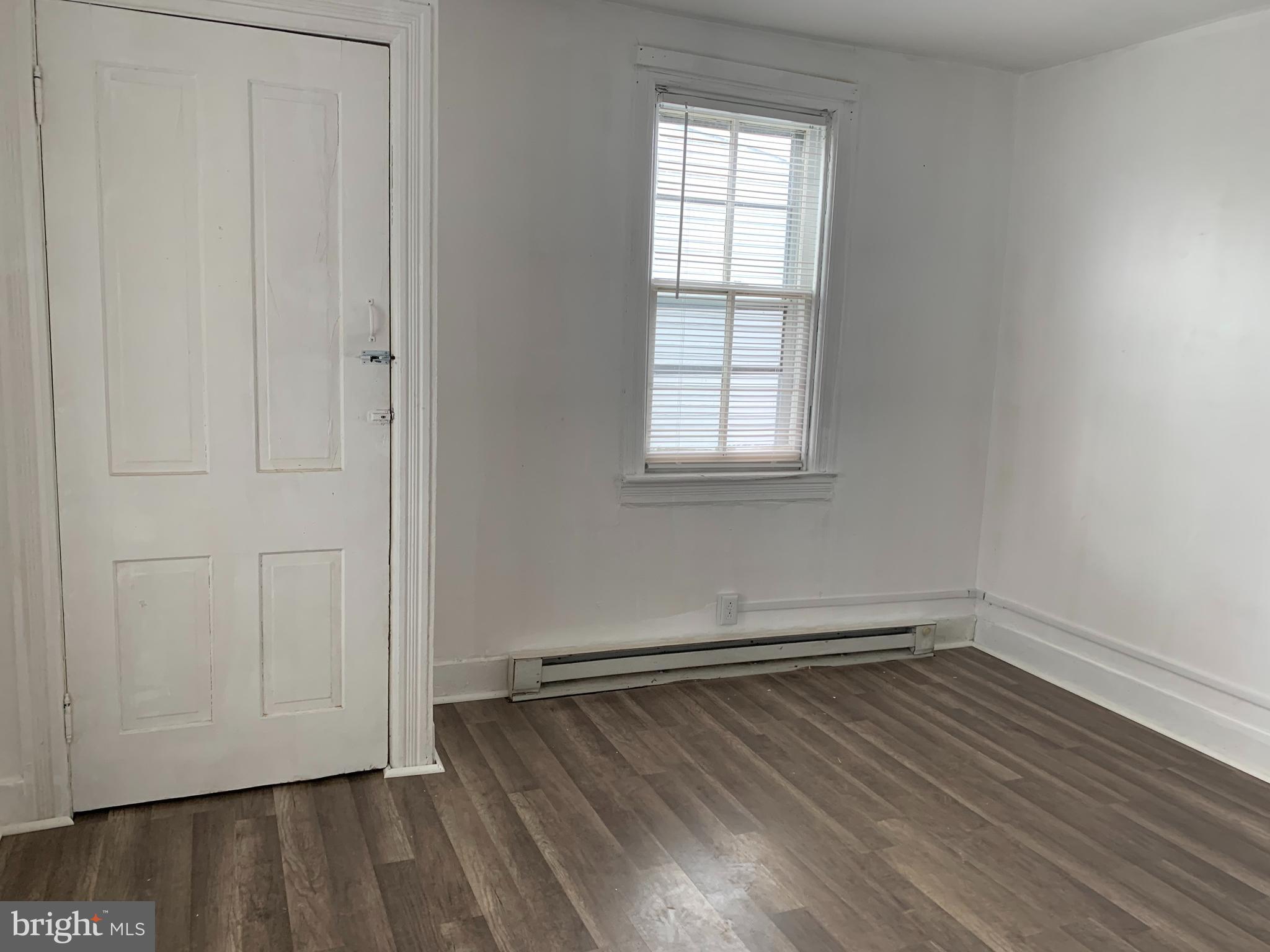 822 Columbus Road Burlington, NJ 08016 - Photo 27 of 32 an empty room with wooden floor and windows