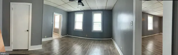 a view of a dining room with furniture and window