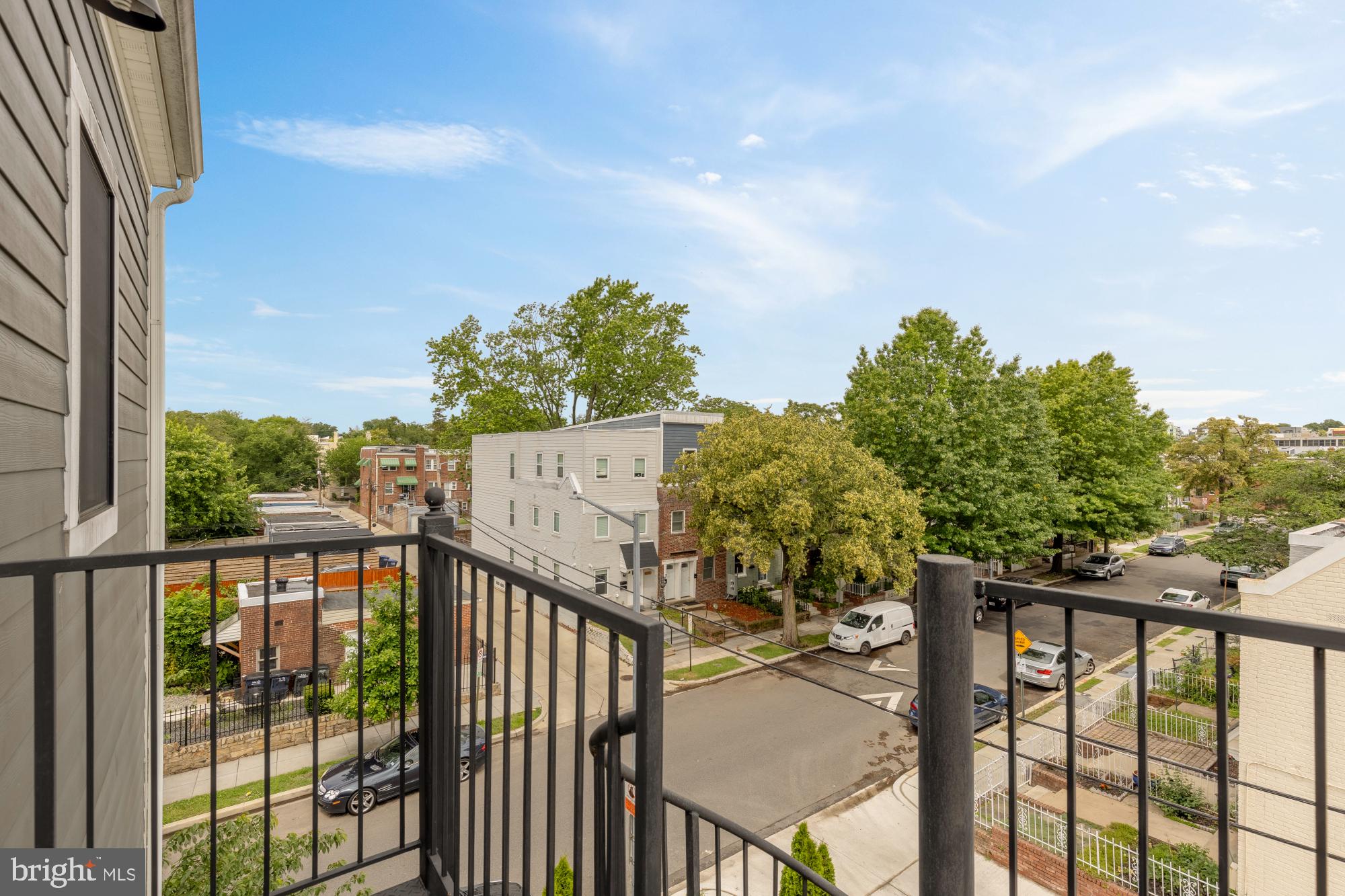 2000 D Street Northeast, Unit 6 Washington, DC 20002 - Photo 20 of 30 a view of a balcony with wooden fence and floor