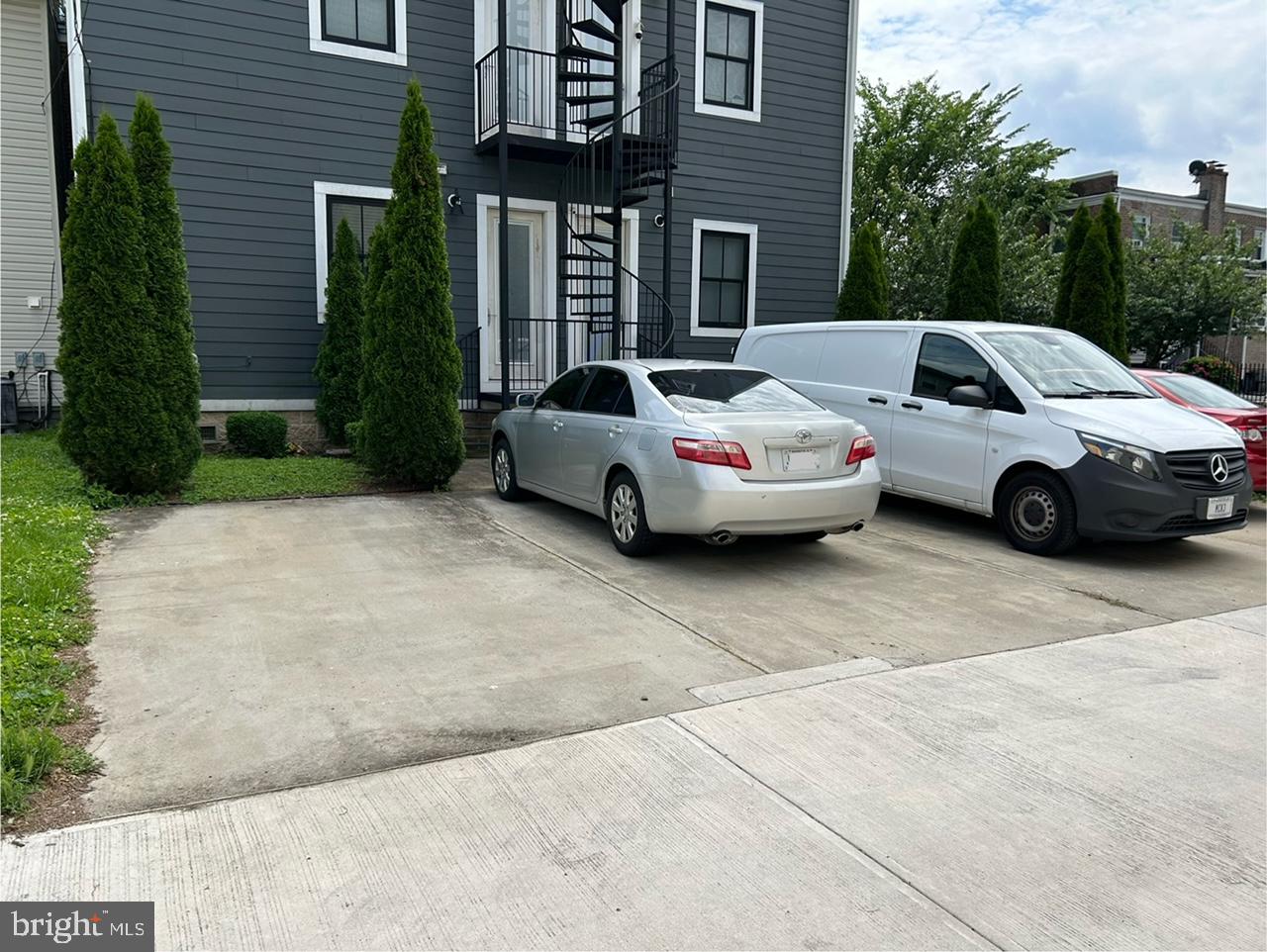 2000 D Street Northeast, Unit 6 Washington, DC 20002 - Photo 22 of 30 a front view of a house with parking space