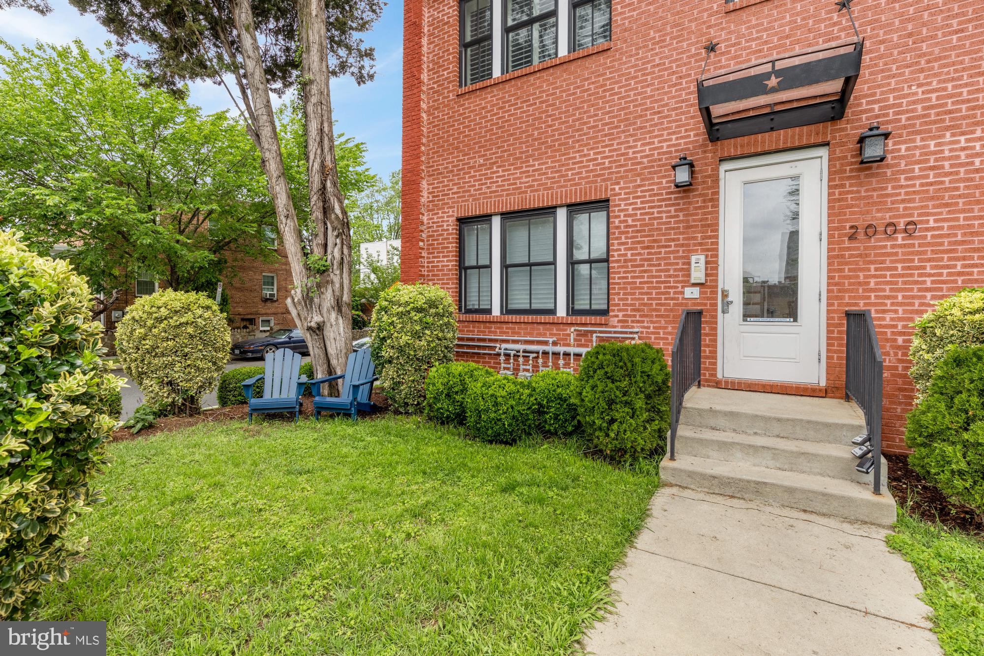2000 D Street Northeast, Unit 6 Washington, DC 20002 - Photo 23 of 30 a view of a house with a yard and plants