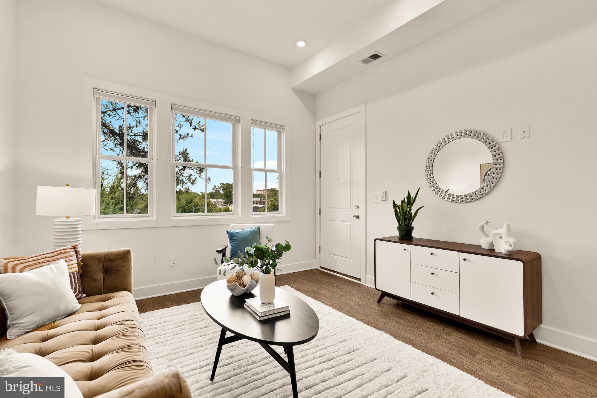 2000 D Street Northeast, Unit 6 Washington, DC 20002 - Photo 3 of 30 a living room with furniture and window