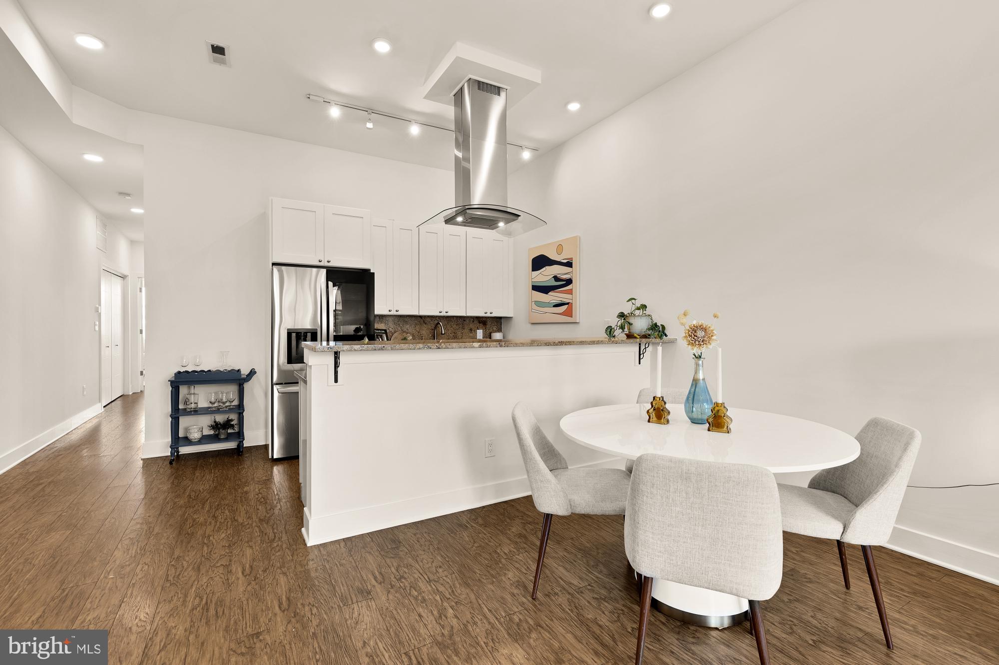 2000 D Street Northeast, Unit 6 Washington, DC 20002 - Photo 4 of 30 a kitchen with a table and chairs