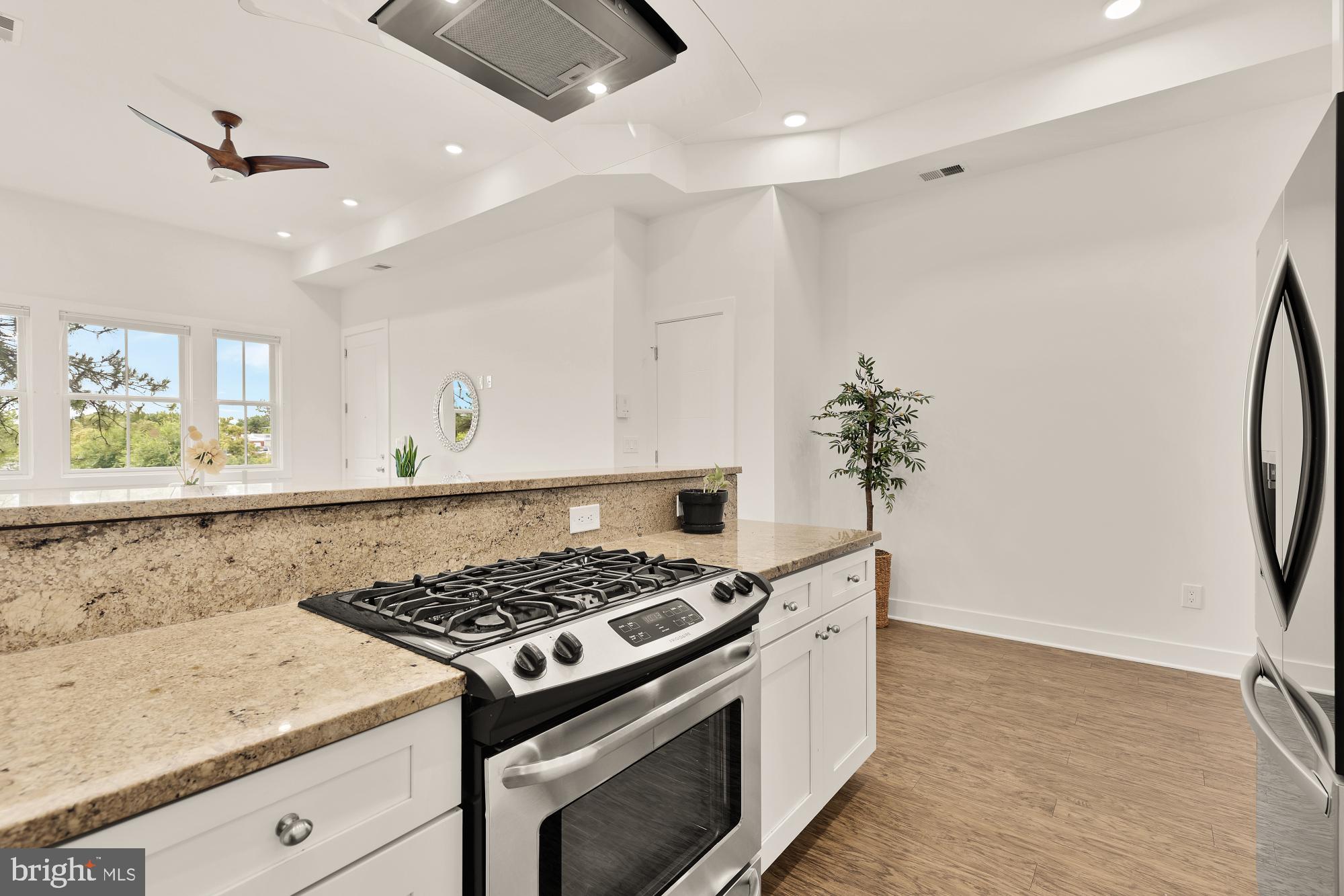 2000 D Street Northeast, Unit 6 Washington, DC 20002 - Photo 10 of 30 a kitchen with a stove and a refrigerator