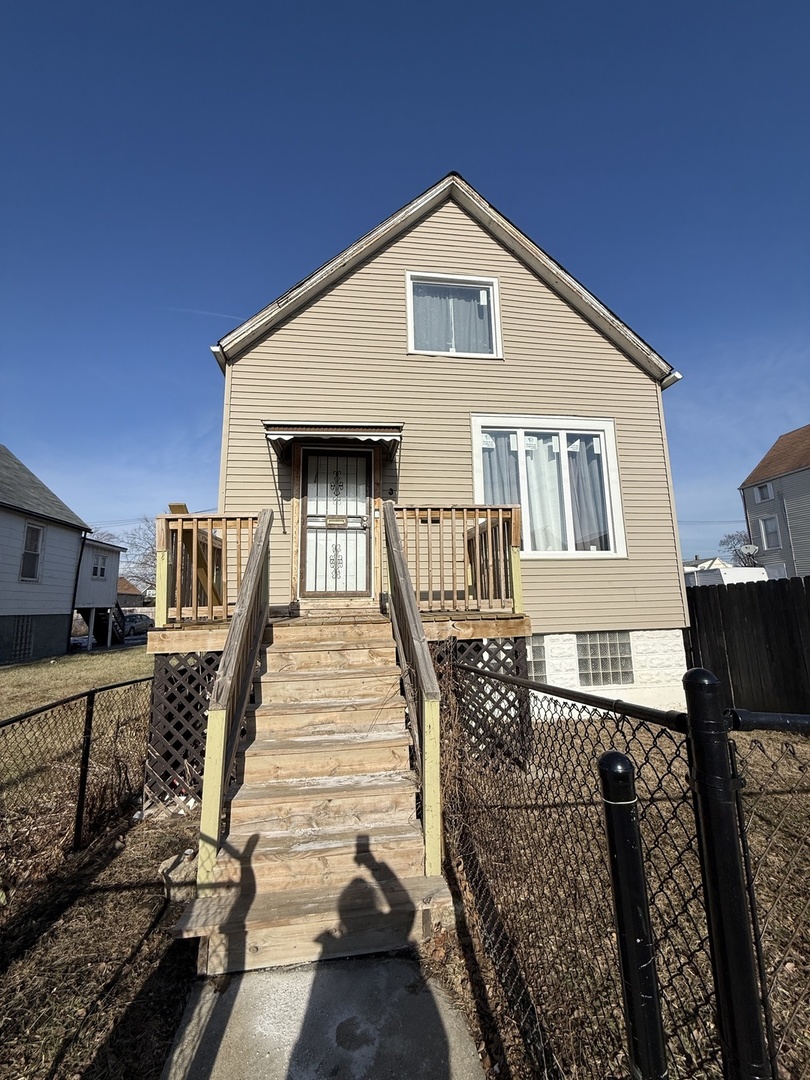 1260 West 74th Street Chicago, IL 60636 - Photo 1 of 14 a front view of a house with many windows