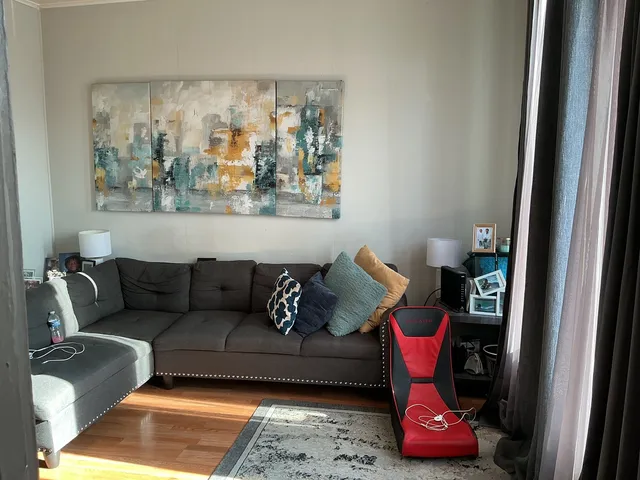 a living room with furniture and rug