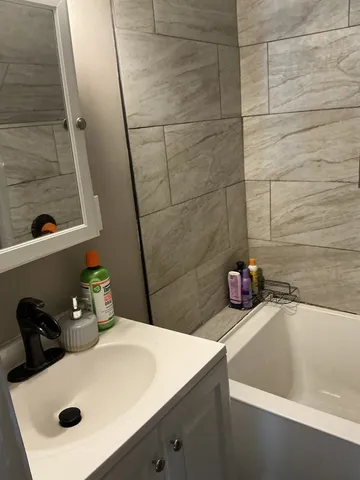 a bathroom with a sink and a tub