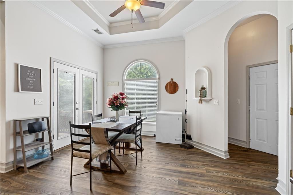 166 Freedom Lane Commerce, GA 30530 - Photo 16 of 25 a view of a dining room with furniture window and wooden floor