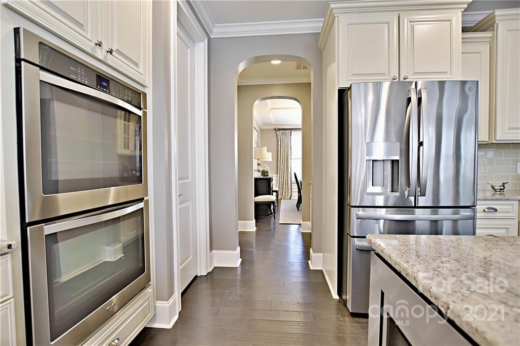 738 Chaucer Circle Fort Mill, SC 29708 - Photo 14 of 44 a kitchen with stainless steel appliances granite countertop a refrigerator and microwave