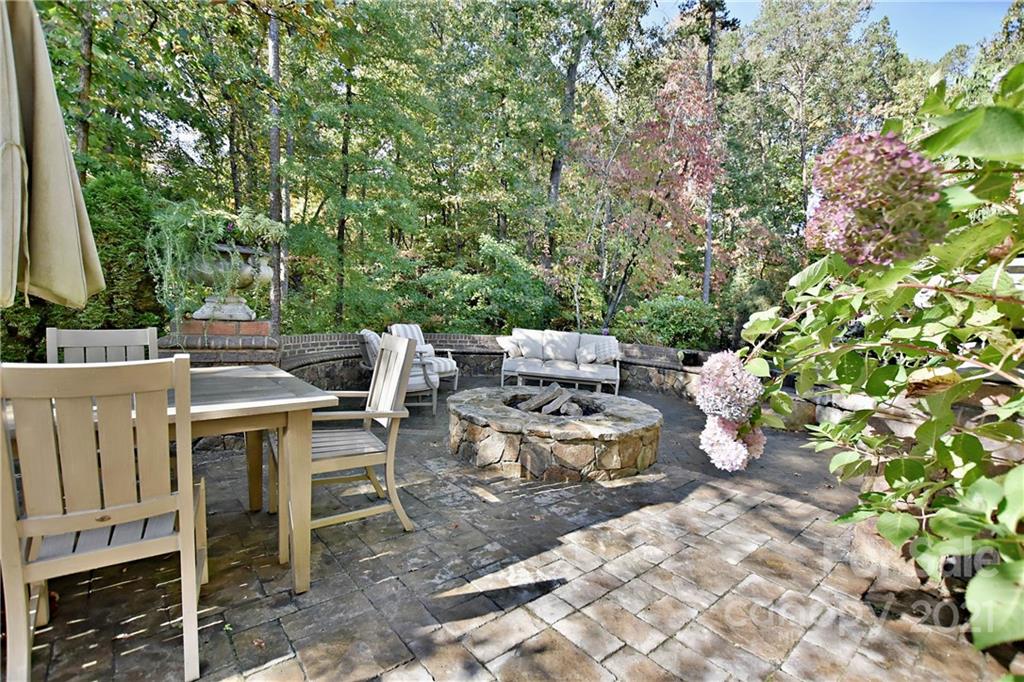 738 Chaucer Circle Fort Mill, SC 29708 - Photo 40 of 44 a view of a patio with table and chairs and potted plants