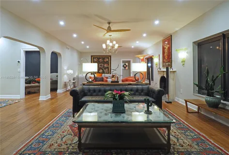 a bedroom with a large bed and a large window